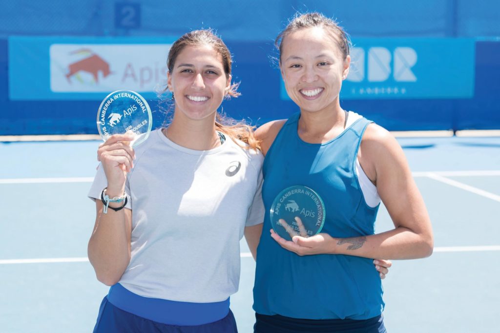 tennis player Alison Bai and doubles partner Jaimee Fourlis holding their trophy