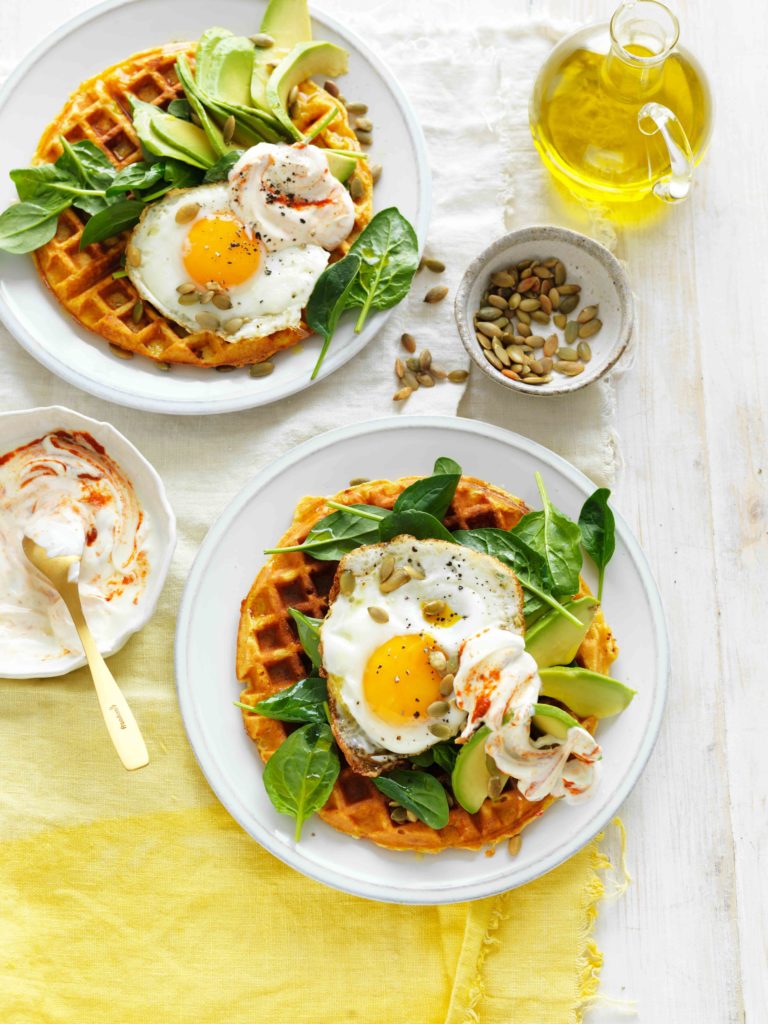 brunch plate with sweet potato waffles with eggs and avocado