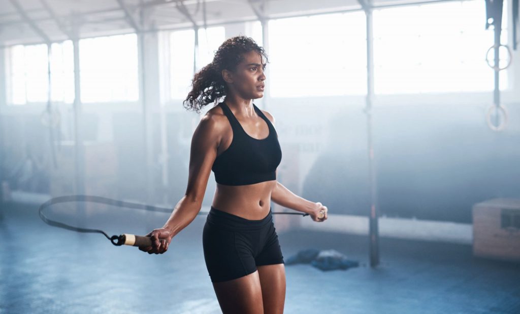 woman doing jump rope for fitness