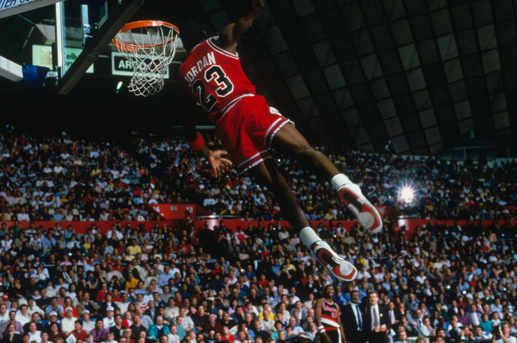 Michael Jordan dunking in front of a packed crowd