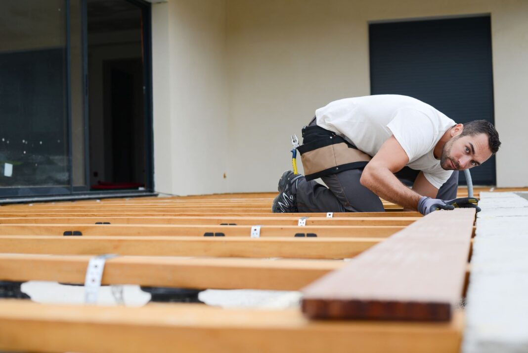 man working on floorboards