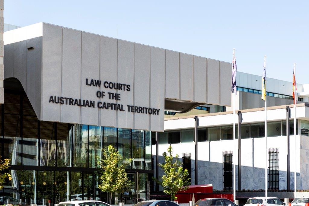 exterior of ACT law courts building with cars parked out front