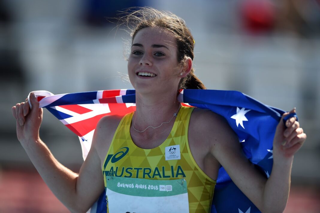 Keely Small draping Australian flag over her shoulders