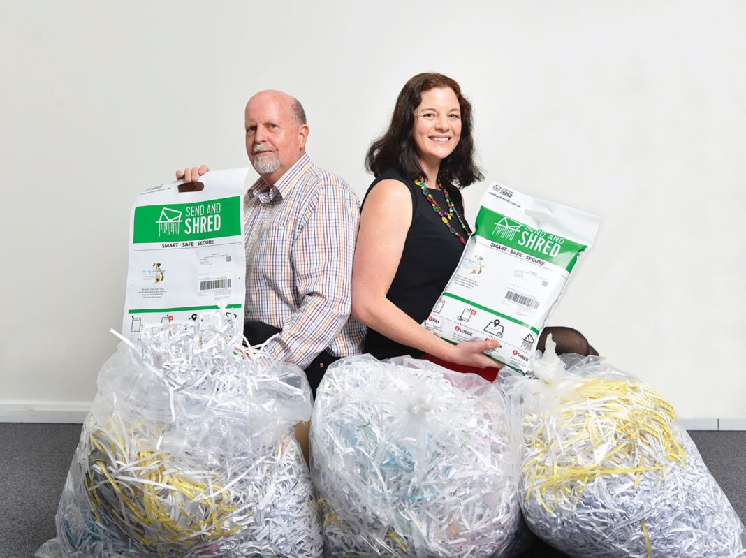 man and woman with lots of shredded paper