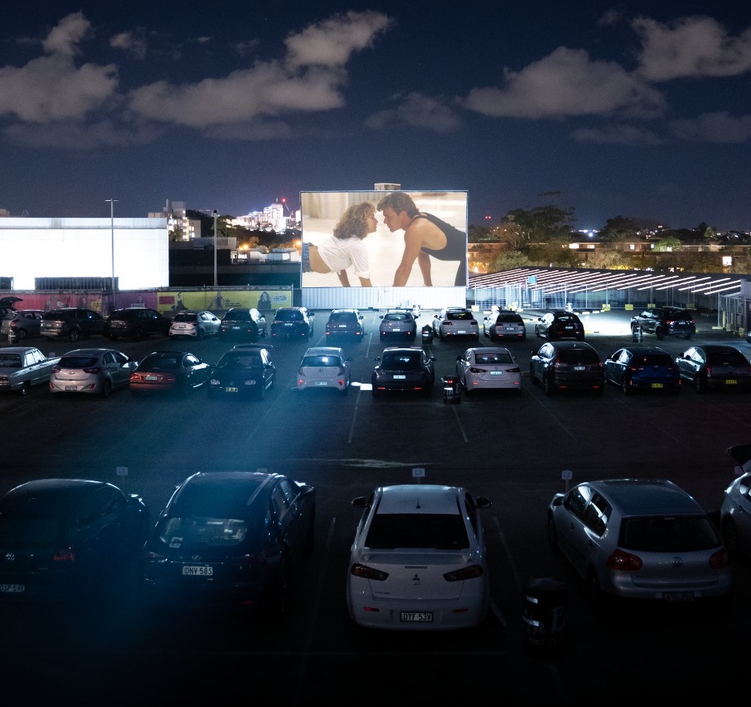 cars parked in at a drive in cinema