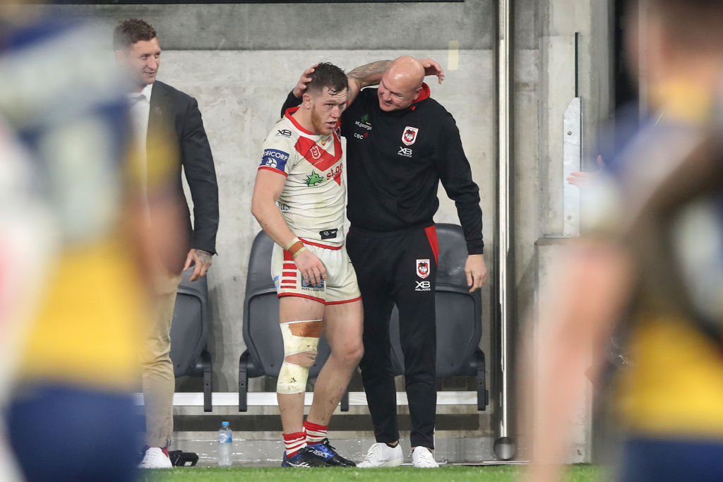 Paul McGregor and Cam McInnes embracing each other