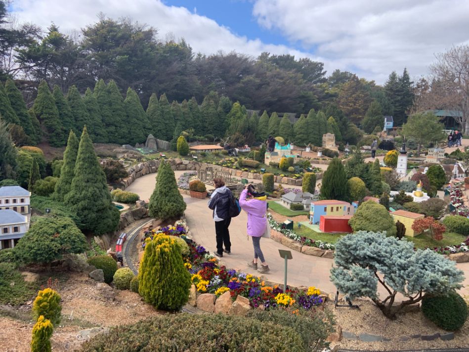 two people walking in Cockington Green Gardens