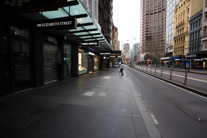 A view of Elizabeth Street with a single person visible during what would usually be peak hour during COVID-19 in Melbourne