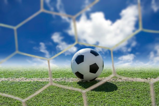 close up of soccer ball through net