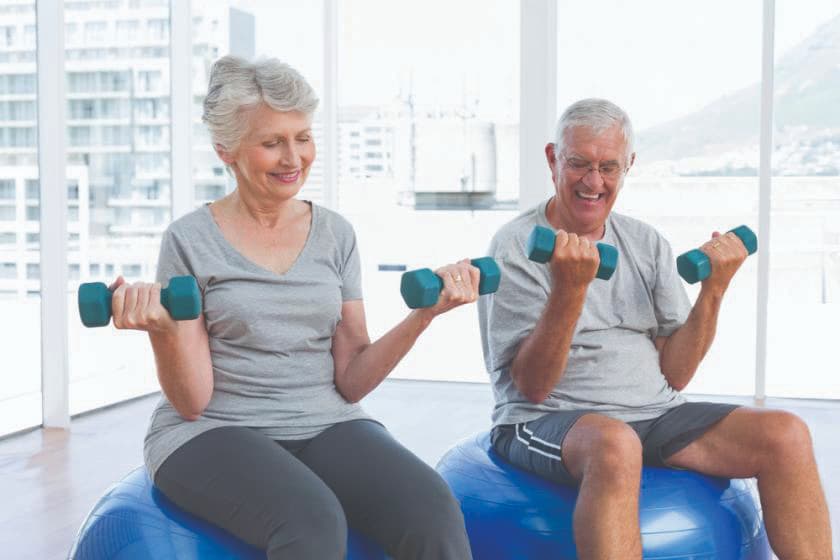 elderly couple lifting weights