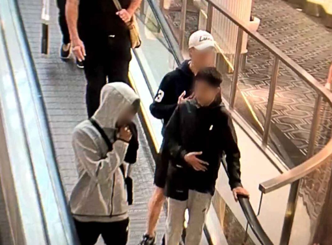 CCTV footage of three teenage boys on travellator with their faces blurred