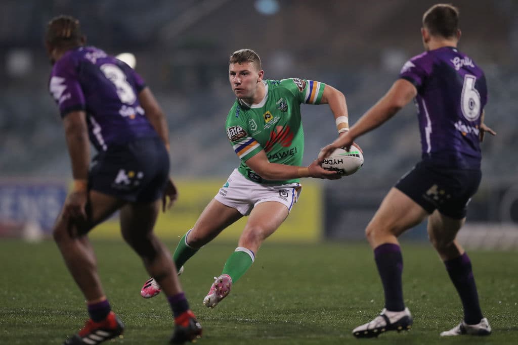 George Williams passing the ball against the Storm