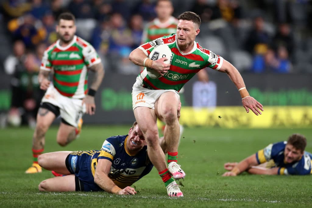 Damien Cook of the Rabbitohs running with the ball against the Eels