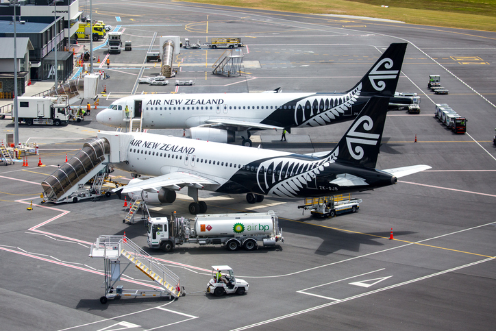 A pair of Air New Zealand jets being serviced on the tarmac at Queenstown Airport