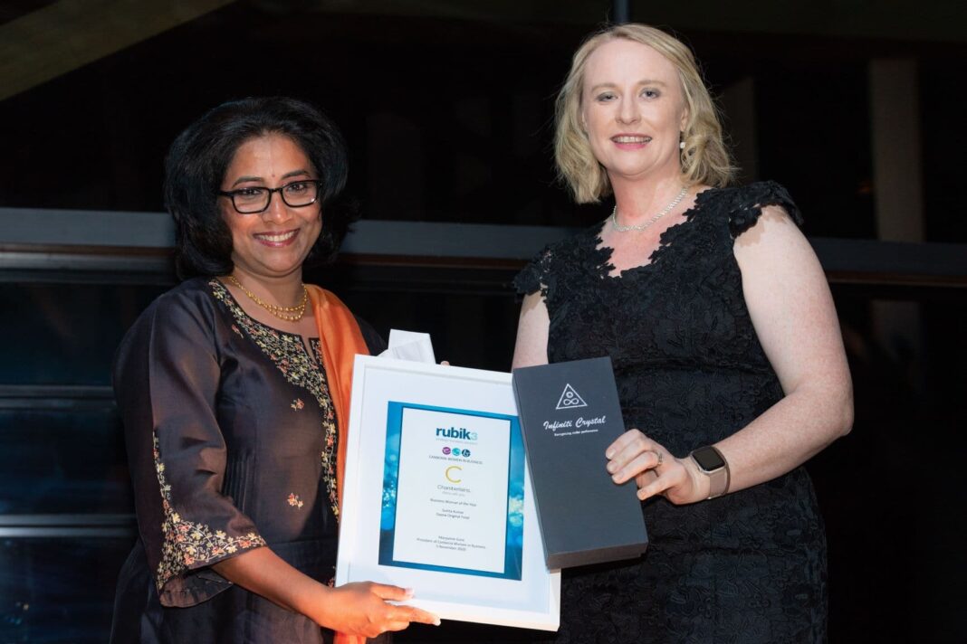 The CWB 2020 Business Woman of the Year, Sunita Kumar, accepts her award from Angela Backhouse