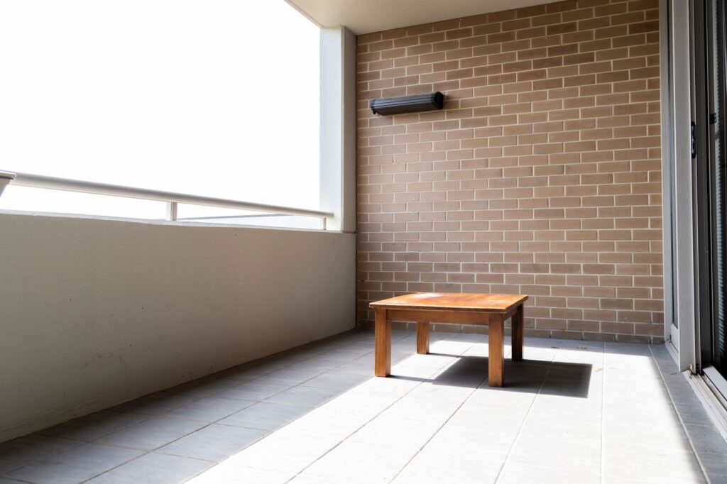 balcony with a small table on it