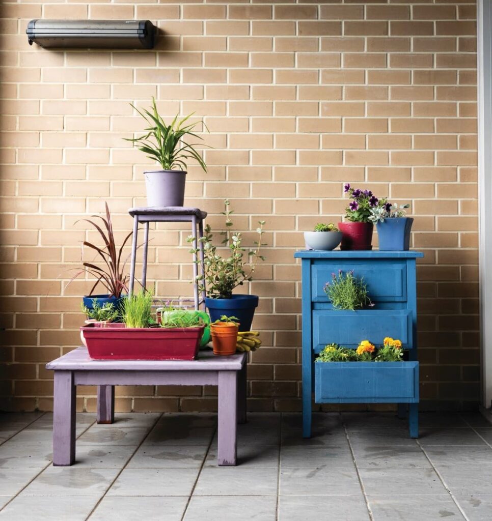 balcony with two colourful tables on it