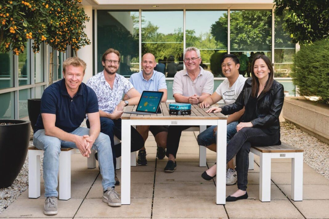 group of people sitting down at a table together