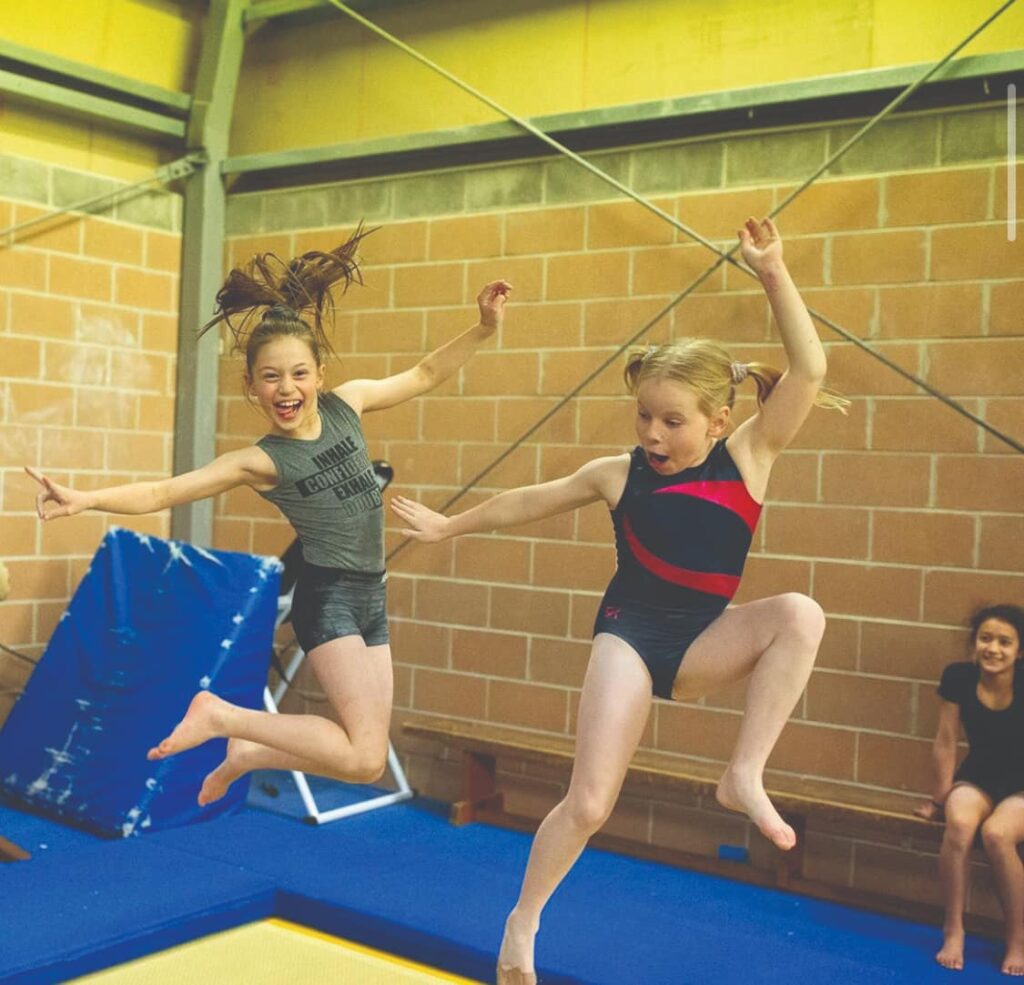 two girls doing gymnastics