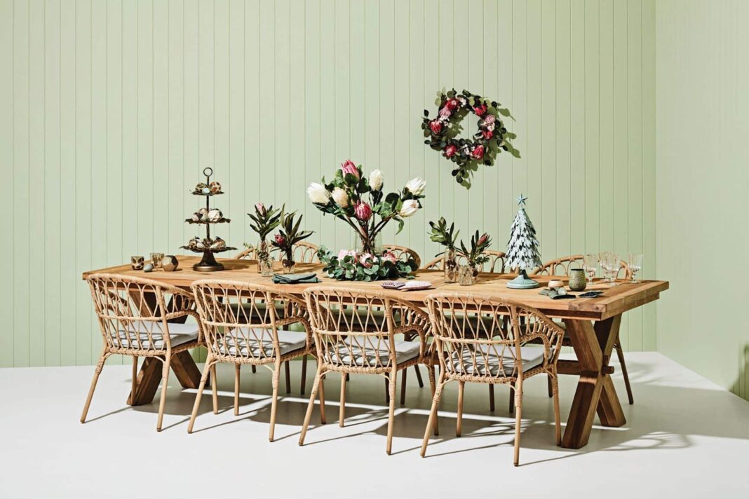 christmas place setting with chairs and a long table