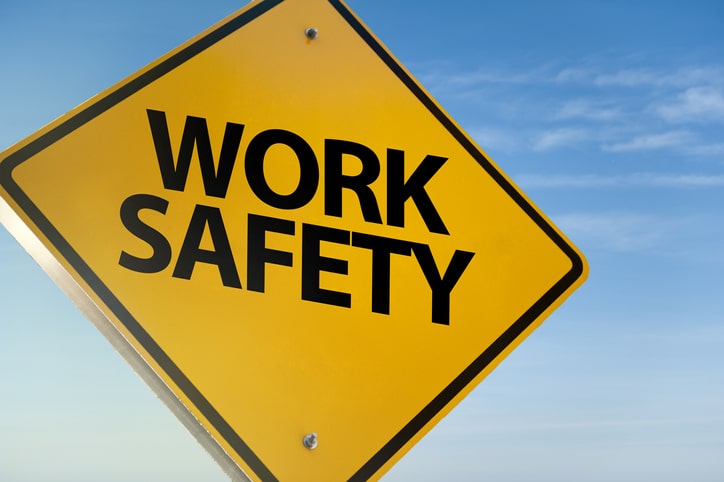 A yellow sign on a blue background that reads 'work safety'