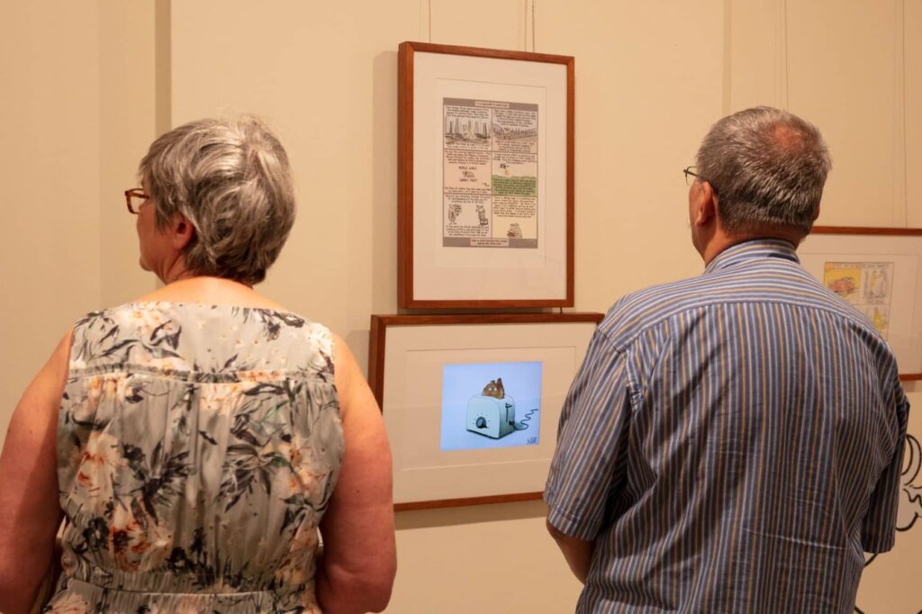 older couple looking at a cartoon