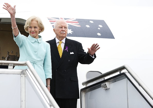 Governor General Quentin Bryce and Michael Bryce wave before boarding their plane during a departure ceremony at RAAF Fairburn on March 26, 2014 in Canberra.