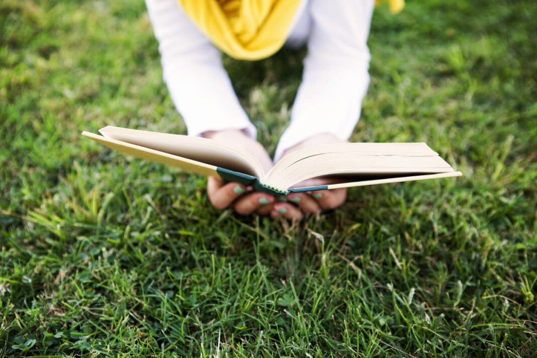 reading book on the grass
