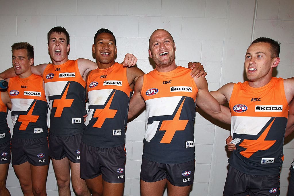 CANBERRA, AUSTRALIA - MAY 12: The Giants celebrate their first AFL victory after the round seven AFL match between the Greater Western Sydney Giants and the Gold Coast Suns at Manuka Oval on May 12, 2012 in Canberra, Australia. (Photo by Ryan Pierse/Getty Images)