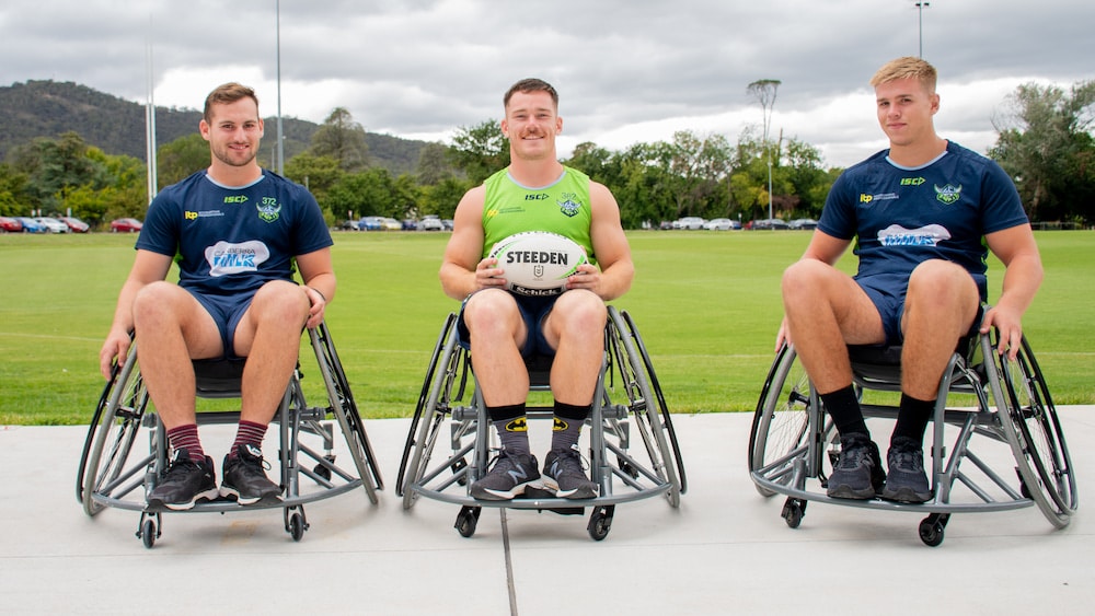 Canberra Raiders NRL players Darby Medlyn, Tom Starling, and Harry Rushton (L-R) are all CRRL wheelchair rugby league ambassadors