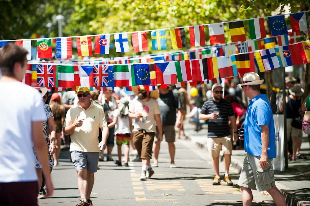 Flags of the world hang across the footpath at a previous National Multicultural Festival