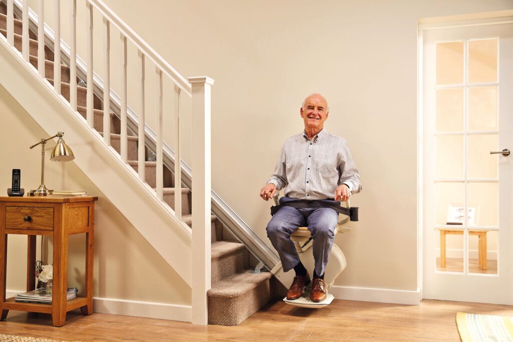 elderly man using chairlift