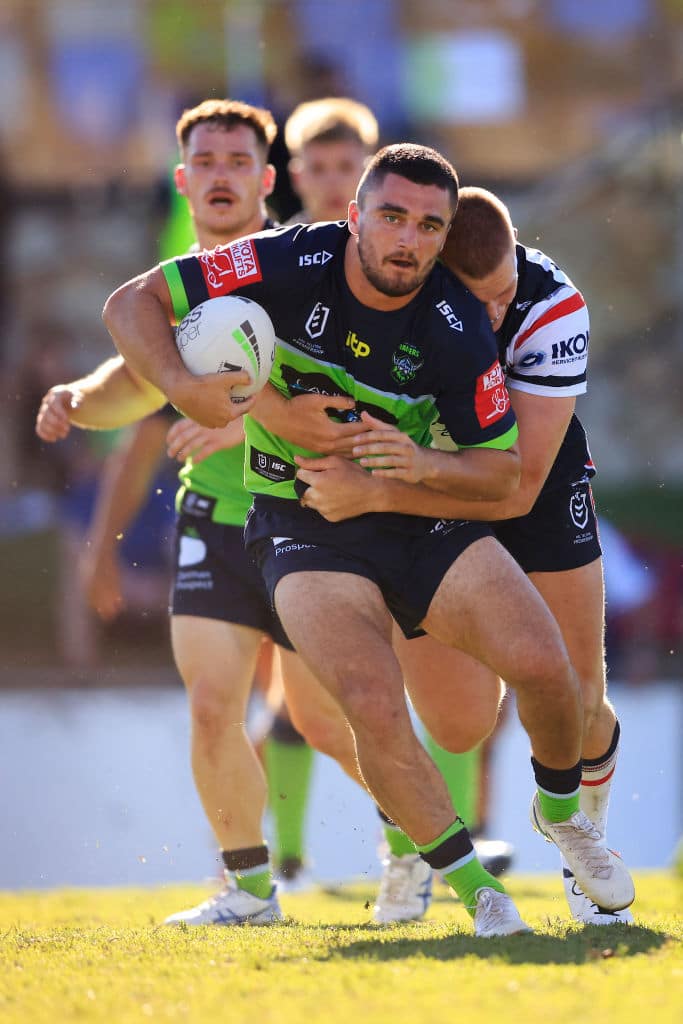 QUEANBEYAN, AUSTRALIA - FEBRUARY 27: Caleb Aekins of the Raiders is tackled during the NRL trial Match between the Sydney Roosters and the Canberra Raiders at Seiffert Oval on February 27, 2021 in Queanbeyan, Australia. (Photo by Mark Evans/Getty Images)