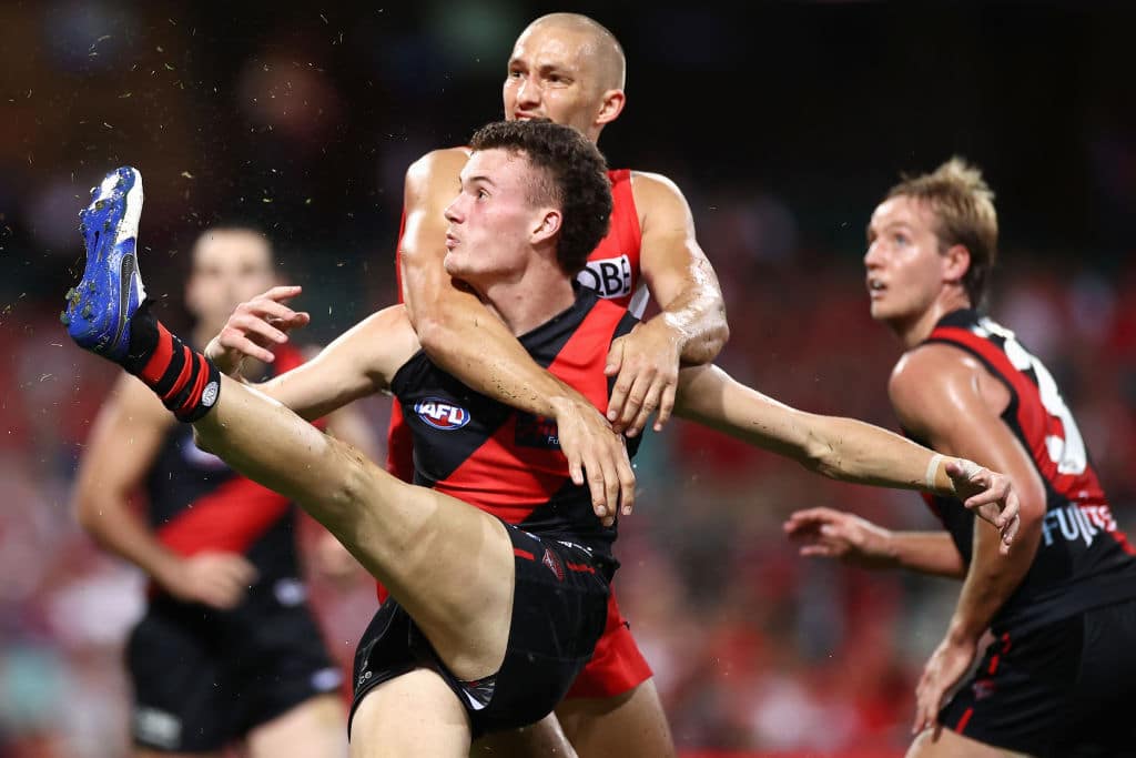 SYDNEY, AUSTRALIA - APRIL 08: Nik Cox of the Bombers kicks during the round four AFL match between the Sydney Swans and the Essendon Bombers at Sydney Cricket Ground on April 08, 2021 in Sydney, Australia. (Photo by Cameron Spencer/Getty Images)