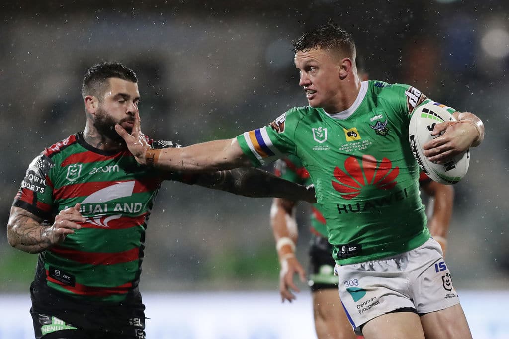 CANBERRA, AUSTRALIA - JULY 25: Jack Wighton of the Raiders hands off Adam Reynolds of the Rabbitohs during the round 11 NRL match between the Canberra Raiders and the South Sydney Rabbitohs at GIO Stadium on July 25, 2020 in Canberra, Australia. (Photo by Mark Metcalfe/Getty Images)