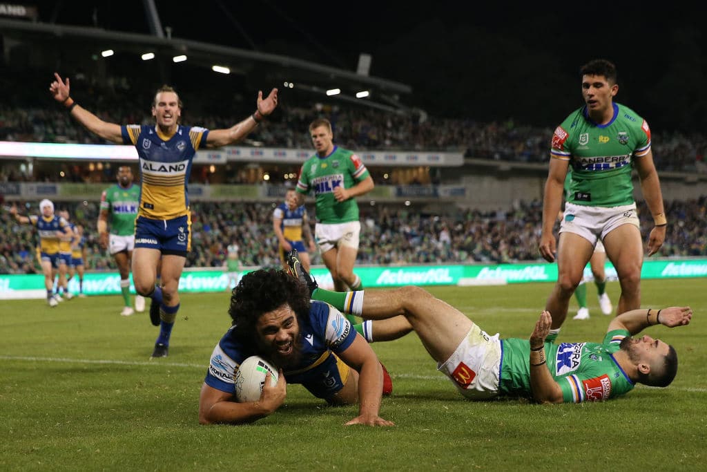 CANBERRA, AUSTRALIA - APRIL 17: Isaiah Papali'i of the Eels celebrates with team mates after scoring a try during the round six NRL match between the Canberra Raiders and the Parramatta Eels at GIO Stadium on April 17, 2021, in Canberra, Australia. (Photo by Matt Blyth/Getty Images)