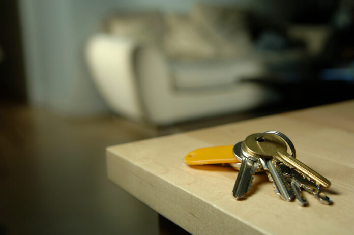 A set of keys on a kitchen bench serves as a visual for a story about housing stress and homelessness