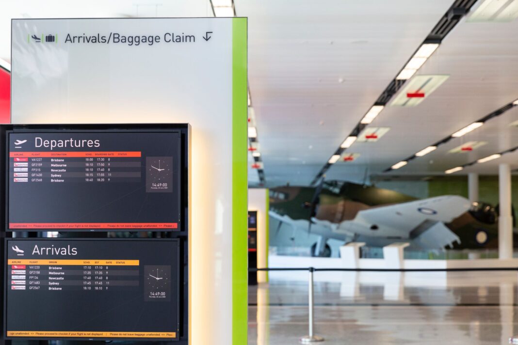 departures and arrivals board each with about five domestic flights listed at Canberra Airport