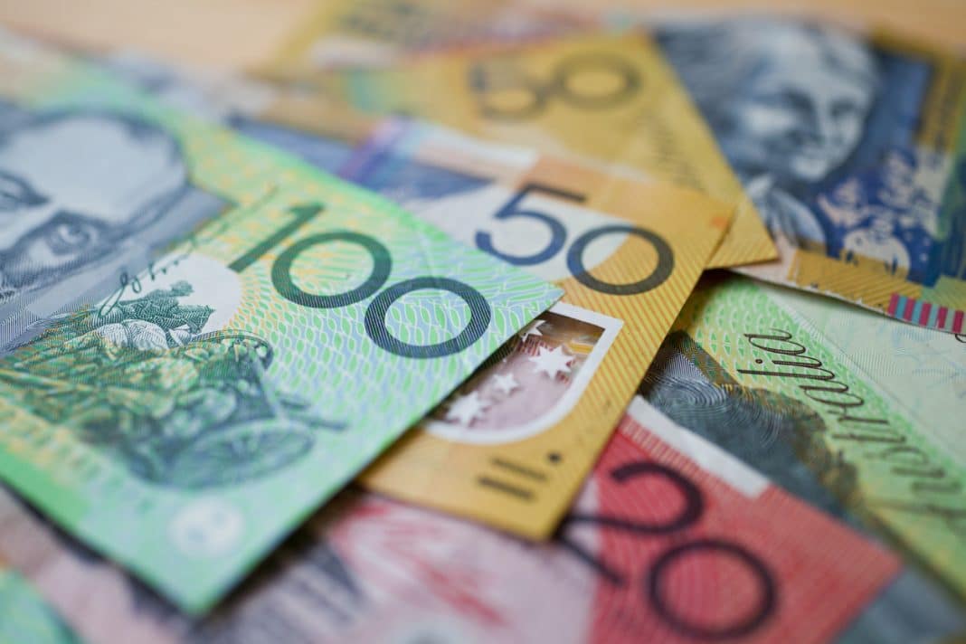 Australian money background showing $100, $50 and $20 notes with a shallow depth of field.
