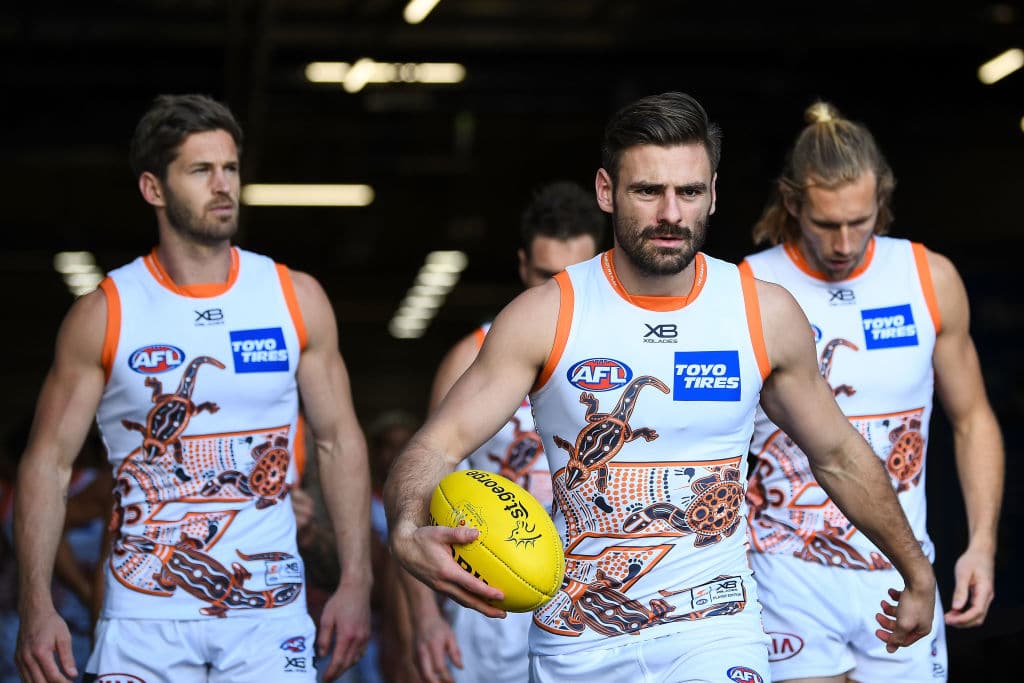 PERTH, AUSTRALIA - AUGUST 23: Stephen Coniglio of the Giants leads the team out to the field during the 2020 AFL Round 13 match between the West Coast Eagles and the GWS Giants at Optus Stadium on August 23, 2020 in Perth, Australia. (Photo by Daniel Carson/AFL Photos via Getty Images)
