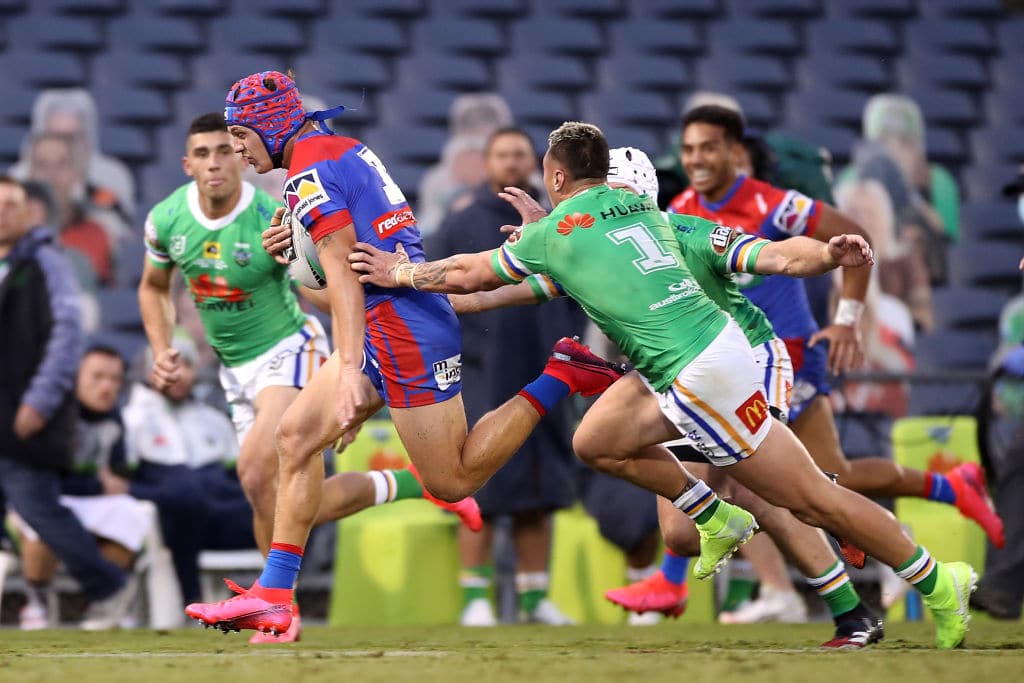 SYDNEY, AUSTRALIA - JUNE 07: Kalyn Ponga of the Knights makes a break to score a try during the round four NRL match between the Canberra Raiders and the Newcastle Knights at Campbelltown Stadium on June 07, 2020 in Sydney, Australia. (Photo by Mark Kolbe/Getty Images)