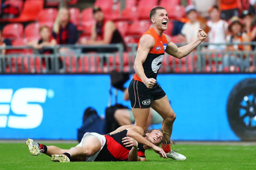 SYDNEY, AUSTRALIA - MAY 08: Jacob Hopper of the Giants celebrates kicking the winning goal during the round eight AFL match between the Greater Western Sydney Giants and the Essendon Bombers at GIANTS Stadium on May 08, 2021 in Sydney, Australia. (Photo by Mark Metcalfe/AFL Photos via Getty Images)
