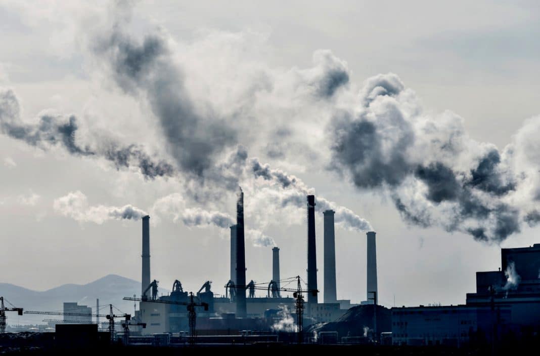 pillars of smoke rising from coal-fired power station