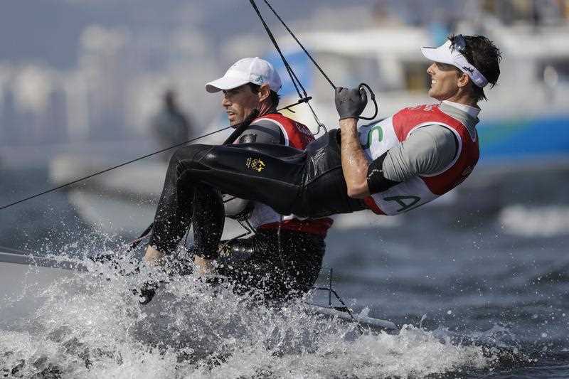 Two Australian male sailors compete on the water during the 470 men medal race at the 2016 Summer Olympics in Rio de Janeiro, Brazil