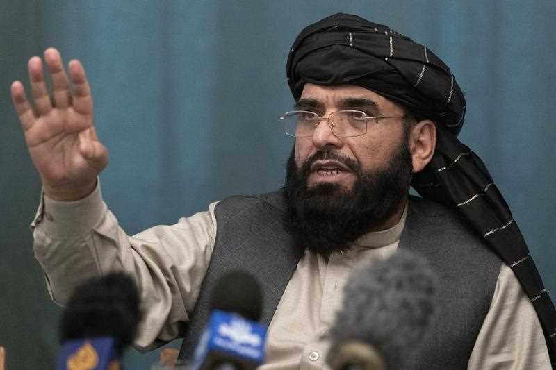 Suhail Shaheen, Afghan Taliban spokesman and a member of the negotiation team gestures while speaking during a joint news conference in Moscow