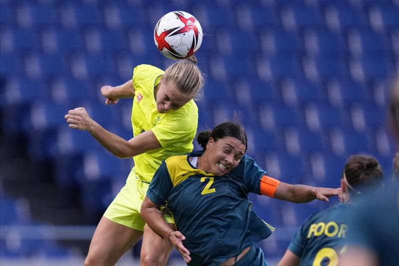 Sweden's Magdalena Eriksson goes for a header against Australia's Sam Kerr (2) during a women's soccer match at the 2020 Summer Olympics