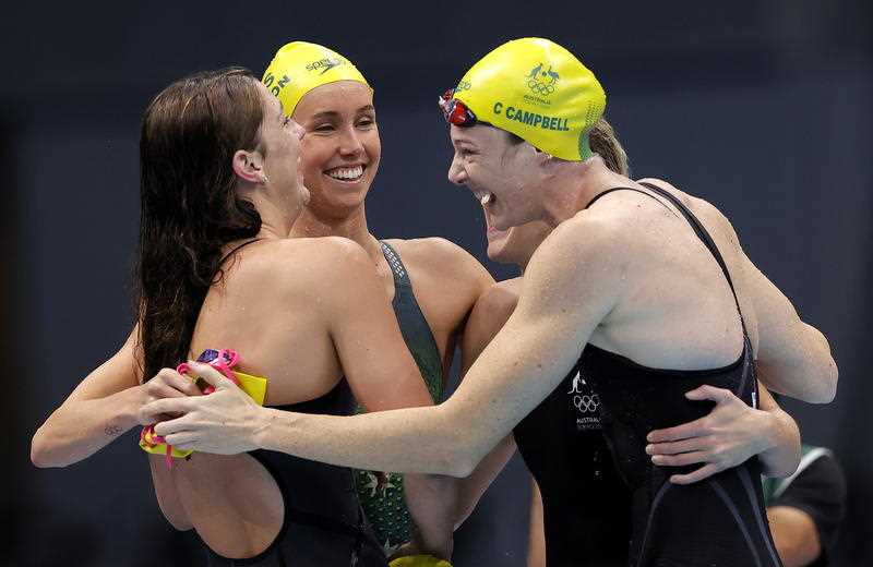 The Australian team celebrate after winning the Women's 4x100m Freestyle Relay final during the Swimming events of the Tokyo 2020 Olympic Games