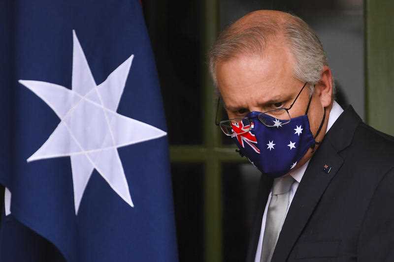 Australian Prime Minister Scott Morrison arrives to speak to the media during a press conference at the Lodge in Canberra