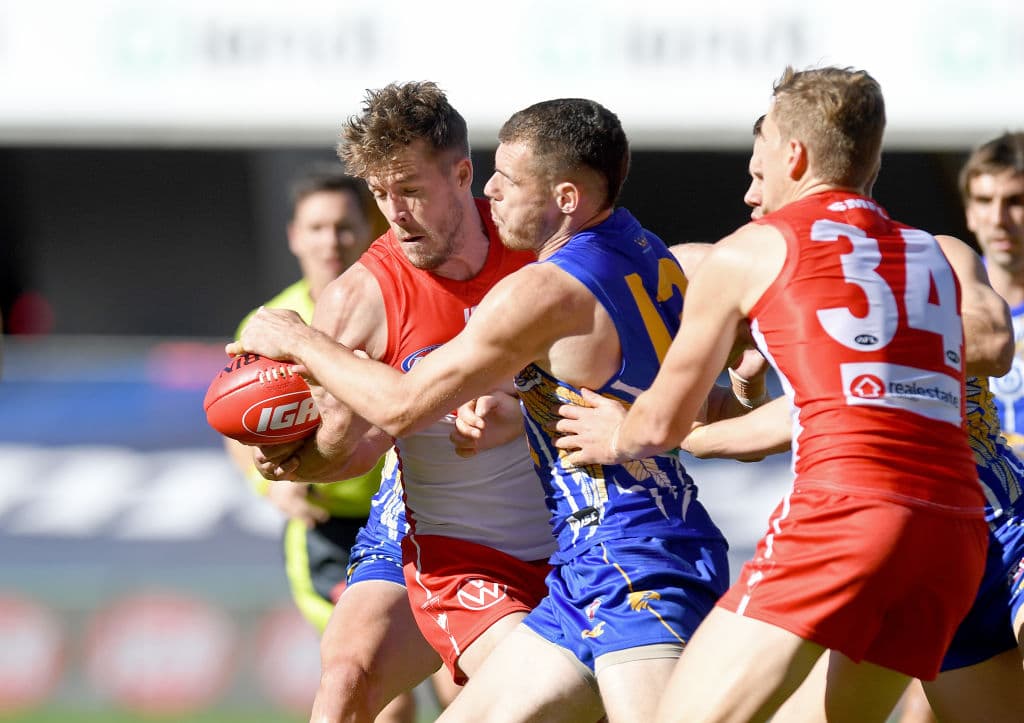 GOLD COAST, AUSTRALIA - JULY 04: Luke Shuey of the Eagles is challenged by the defence during the round 5 AFL match between the West Coast Eagles and the Sydney Swans at Metricon Stadium on July 04, 2020 in Gold Coast, Australia. (Photo by Bradley Kanaris/Getty Images)