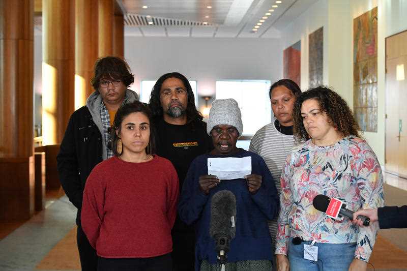 Six Indigenous Australians are seen holding a press conference at Parliament House in Canberra to express their opposition to gas fracking in the Beetaloo Basin in the Northern Territory